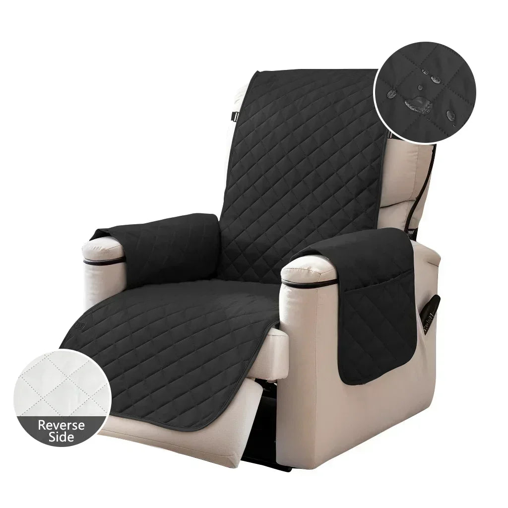 A black washable slipcover for a beige recliner sofa with an anti-slip strap visible.