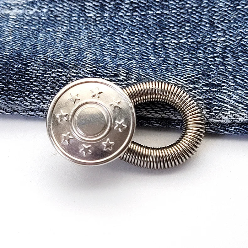 Silver extender buttons attached to a dark blue denim fabric.