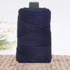 A spool of dark navy blue 3mm ice rope crochet yarn for crafting.