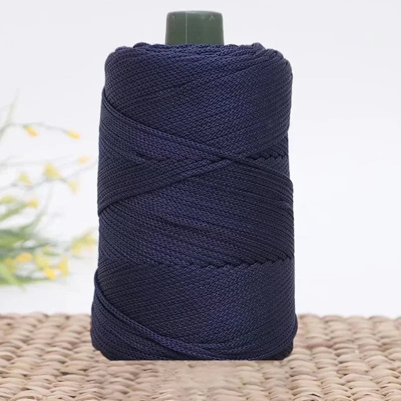 A spool of dark navy blue 3mm ice rope crochet yarn for crafting.