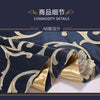A close-up of dark blue fabric with gold damask patterns, showing a folded piece used for decorative bed flags.