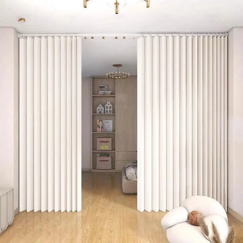 Heavy duty foldable room divider curtain in white fabric dividing a room.
