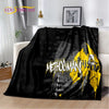 Black flannel throw blanket featuring a yellow and black metal band graphic design