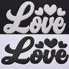 Black die-cut vinyl sheet featuring the words Love in a script font with heart accents.