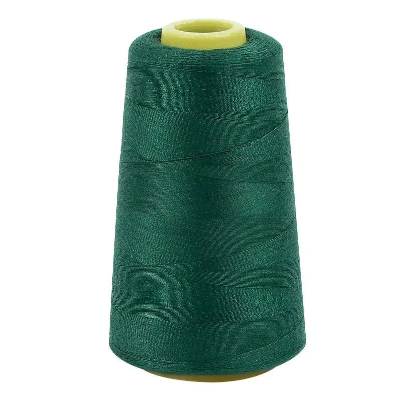 A roll of dark green sewing thread with a light yellow core.