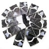 A set of stainless steel circular knitting needles with decorative tips, packaged in individual foil wrappers.