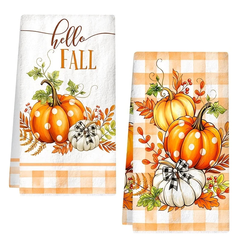 Two kitchen towels featuring an orange pumpkin and plaid design for the Hello Fall collection