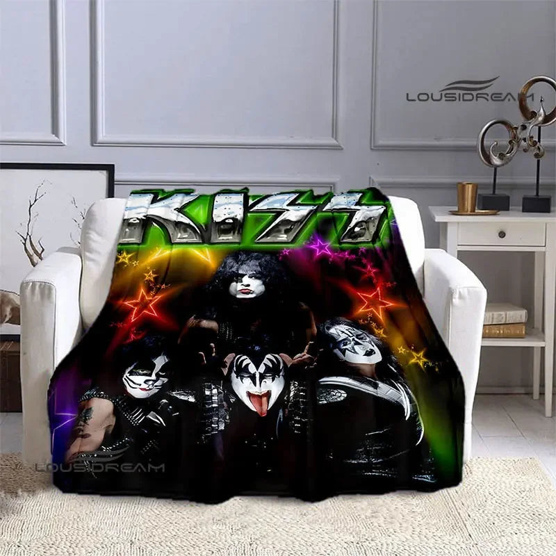 A black and neon graphic printed flannel travel blanket featuring KISS band members.