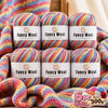 A set of six balls of fancy wool yarn in various multicolored gradients, packaged for knitting and crochet projects.