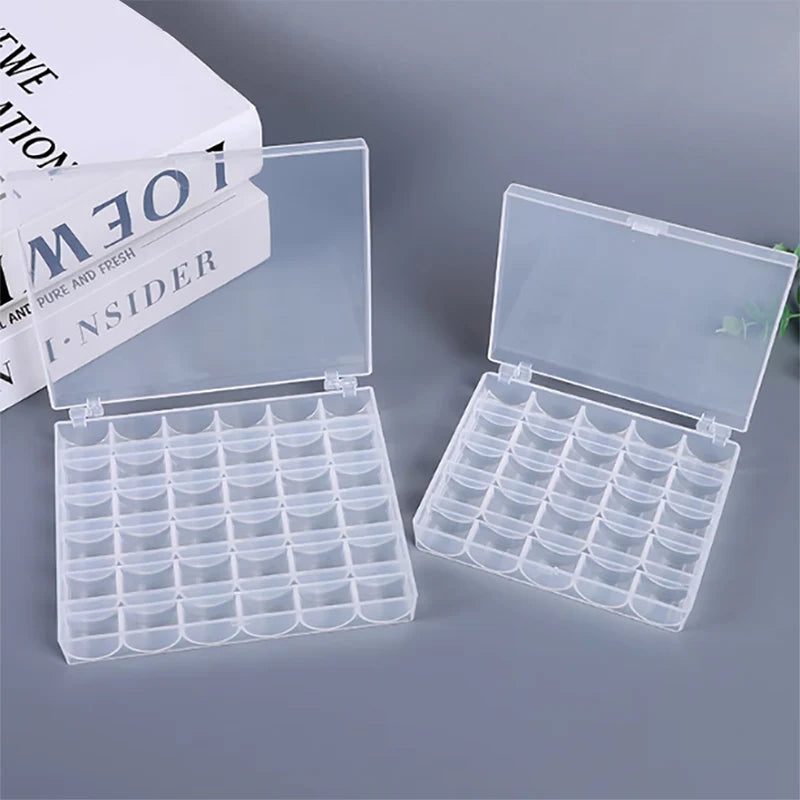 A clear plastic storage case containing a 25-piece set of sewing machine bobbins.