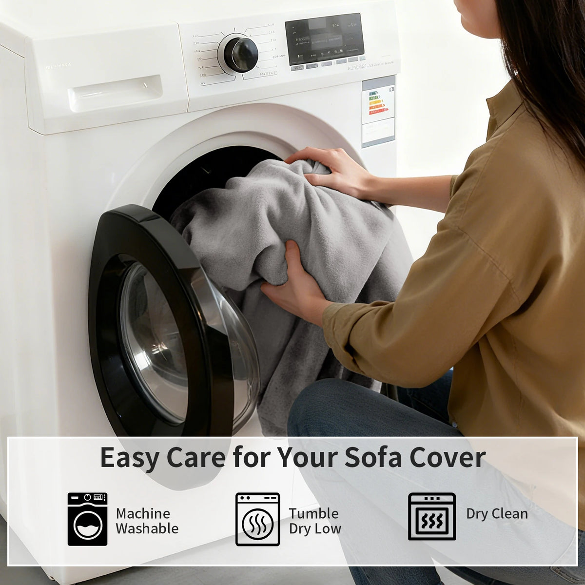 A person is placing a gray sofa cover into a white washing machine for easy care.
