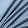 Soft blue luxury bamboo flat sheets draped and folded