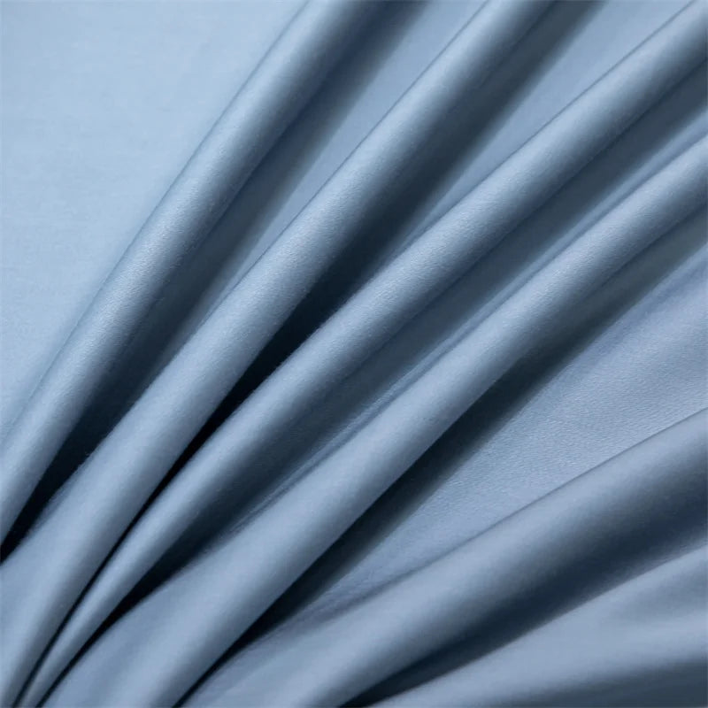 Soft blue luxury bamboo flat sheets draped and folded