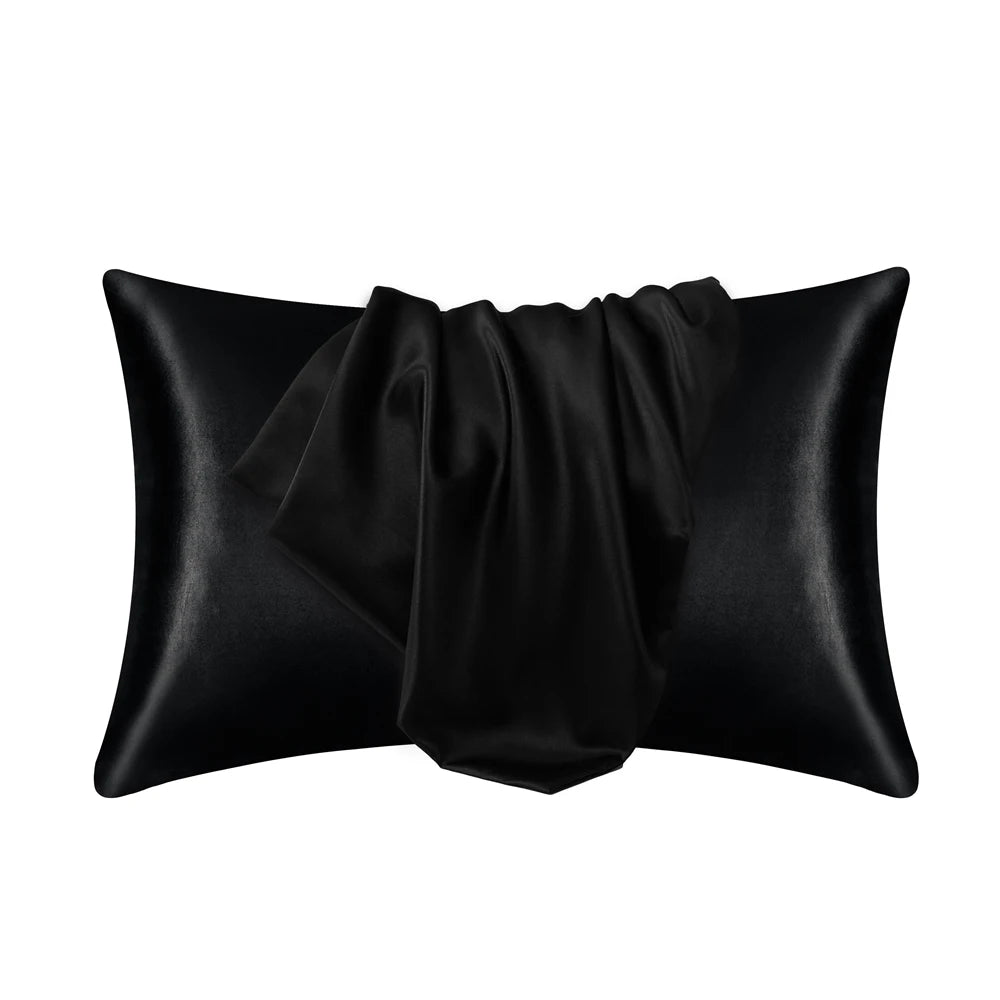 Black satin silk pillow covers folded and displayed