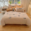 A beige embroidered bedding set featuring cartoon dog designs on a bed with light curtains.