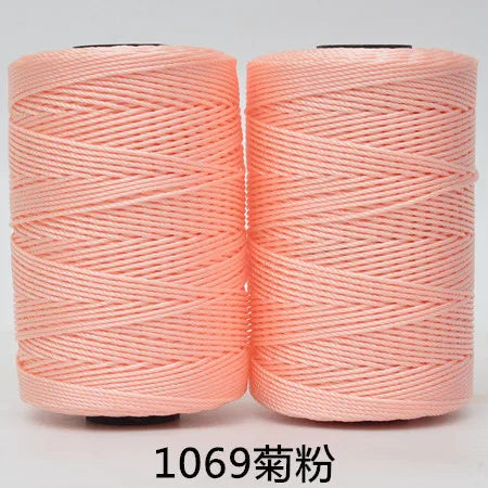 Two spools of pink hand knitting and crochet cord for crafting