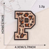 A leopard print iron-on patch shaped like the letter P, measuring 6cm high and 4.3cm wide.