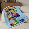 A light blue flannel blanket featuring colorful characters and a rainbow design.