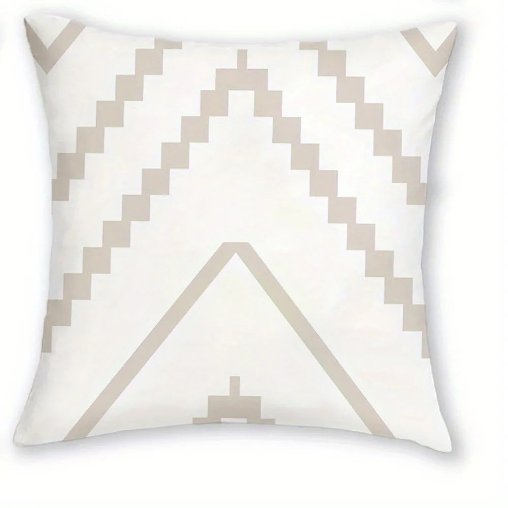 A white decorative pillow cover featuring a geometric pattern of light beige zigzags and a central triangle design.