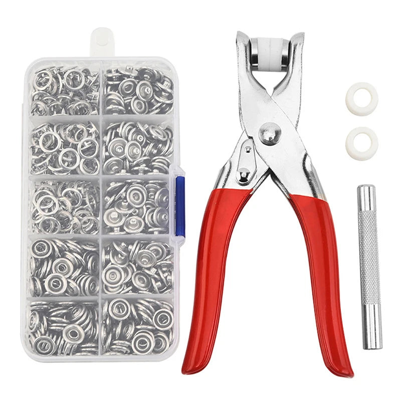 A clear plastic case containing assorted metal snaps and a pair of silver pliers for installation.