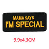 Black iron-on embroidered letter patch with yellow text that reads Mama Says I'm Special