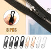 A set of eight replacement zipper pullers in black and silver colors shown against a black fabric background.