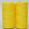 Two spools of bright yellow hand knitting and crochet cord for crafting