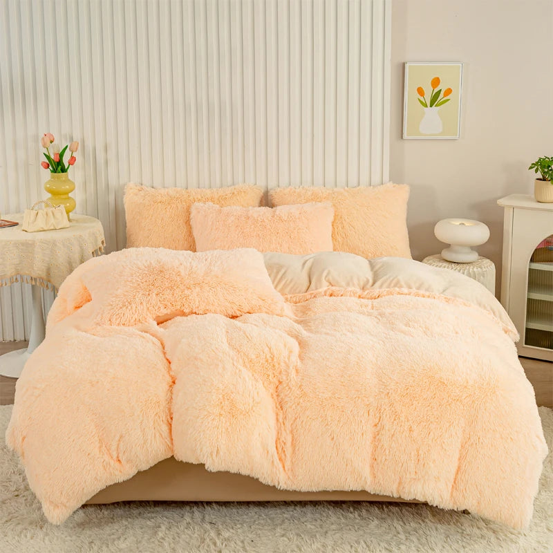 A fluffy peach colored plush duvet cover set displayed on a bed with white and neutral decor.