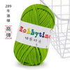 A ball of bright green thick polyester craft yarn used for knitting and crochet projects.