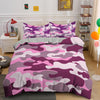 A purple and pink camouflage duvet cover set displayed on a bed with white nightstands.