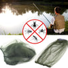 A multi-pack of adjustable mosquito protection fishing hats shown next to a person fishing by the water.