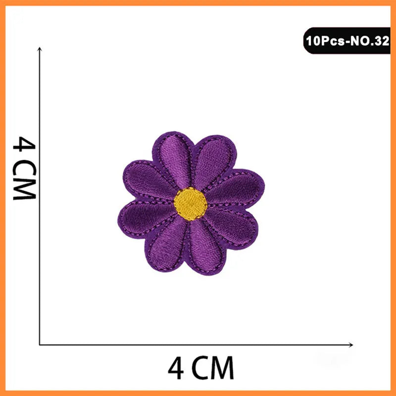 A set of 10 purple and yellow embroidered flower patches for iron-on use.