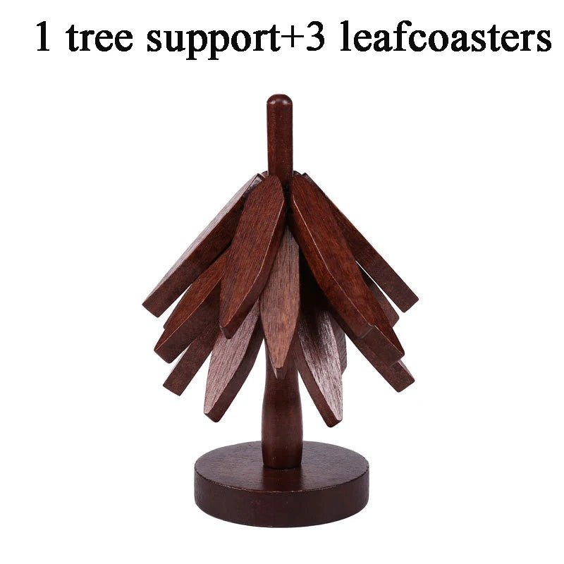 A wooden tree support with three leaf coasters made of dark wood.
