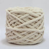 A ball of soft, cream-colored chenille knitting yarn coiled for hand crafting.