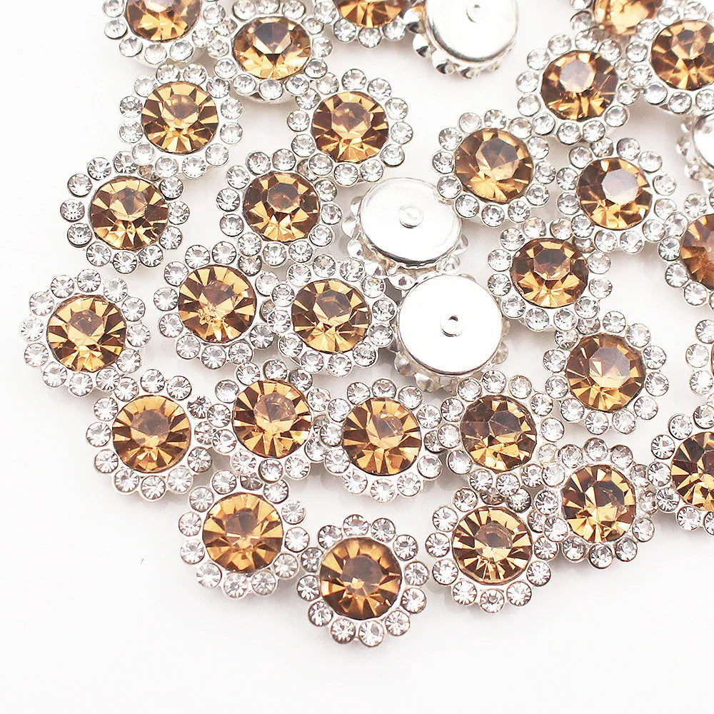 Close-up of sunflower crystal rhinestone sew-on buttons in gold and silver tones.