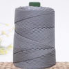 Gray crochet ice rope wound tightly on a spool with a green cap.
