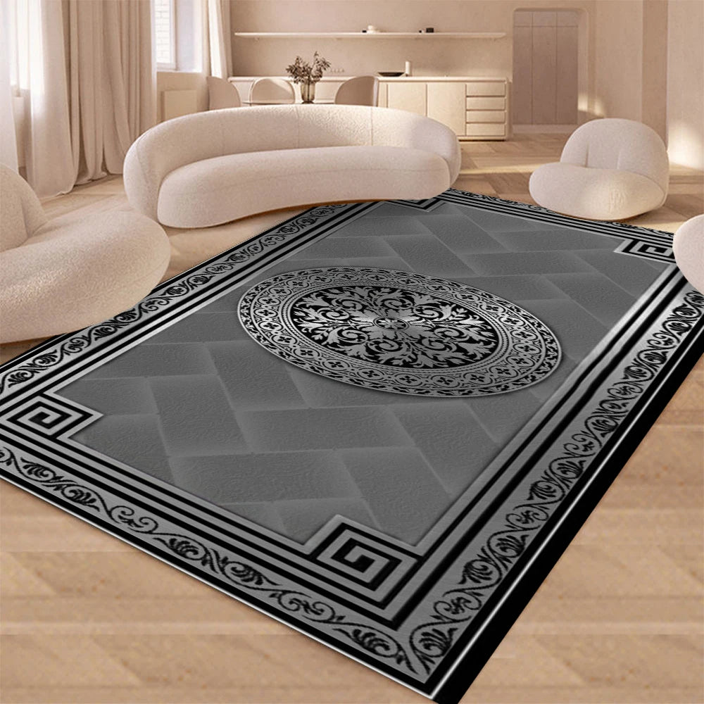 A modern geometric soft area rug with gray and black patterns in a living room setting.