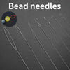 A set of stainless steel bead needles for jewelry making displayed on a dark surface.