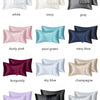A collection of silky satin pillow covers in various colors including white, ivory, gray, dusty pink, teal, navy blue, burgun