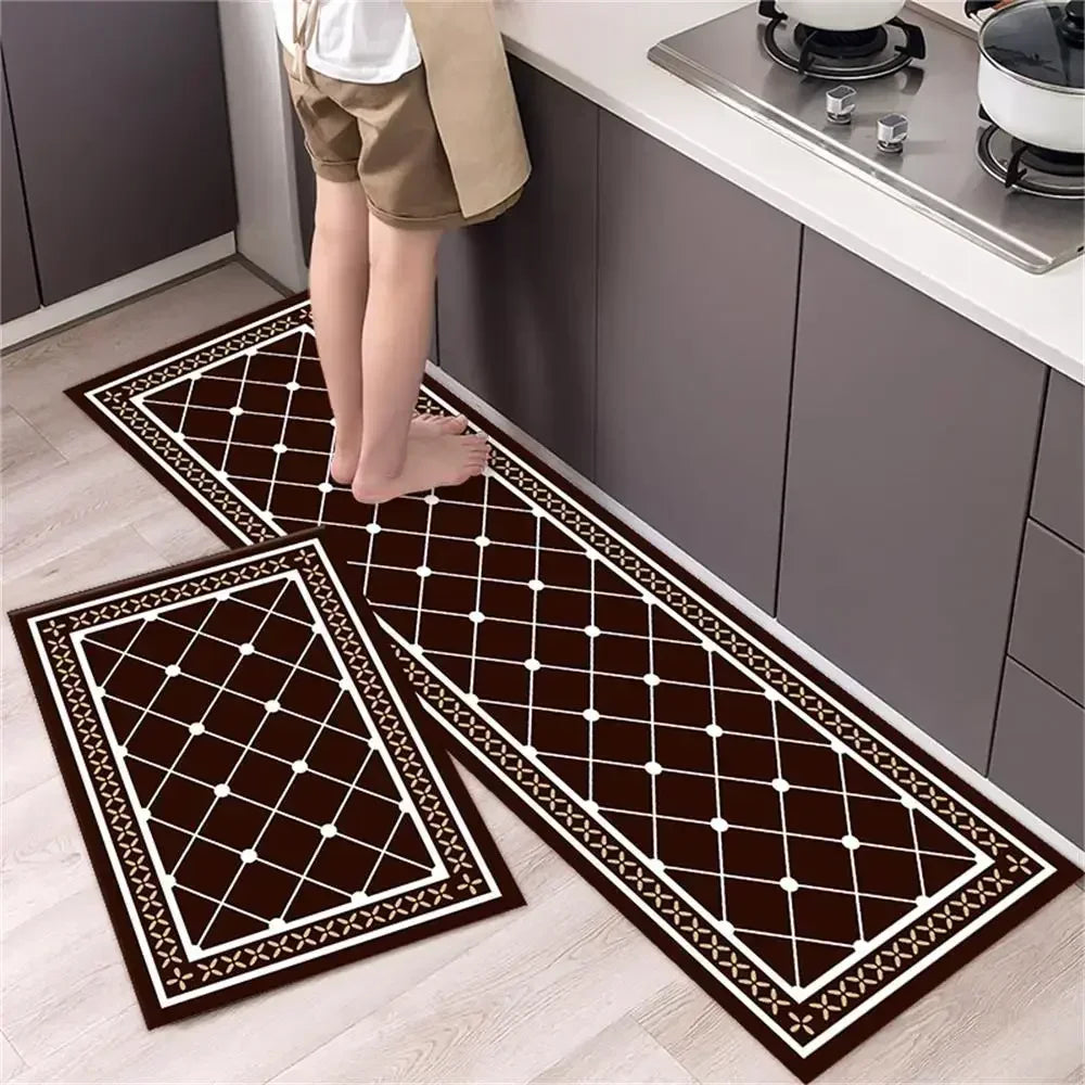 A dark brown diamond print non-slip kitchen rug set featuring white borders placed on a light wood floor.