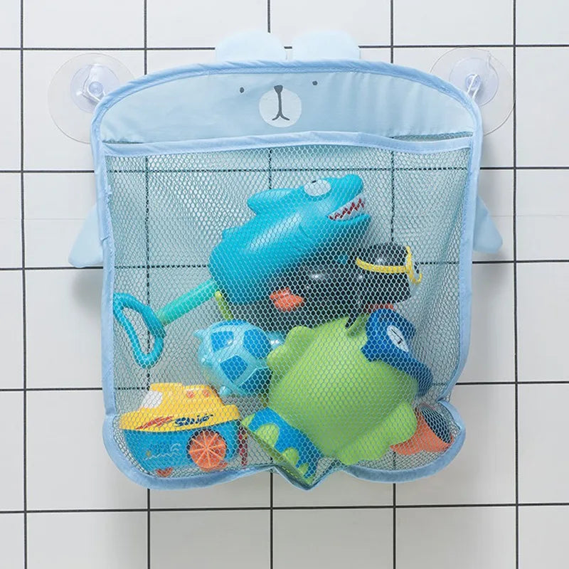 A light blue bear-shaped mesh storage bag filled with various colorful baby bath toys and accessories.