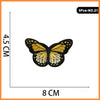A set of five embroidered iron-on patches featuring a butterfly and rose design.