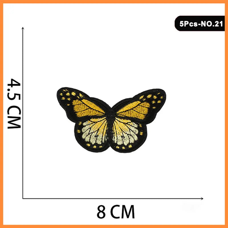 A set of five embroidered iron-on patches featuring a butterfly and rose design.