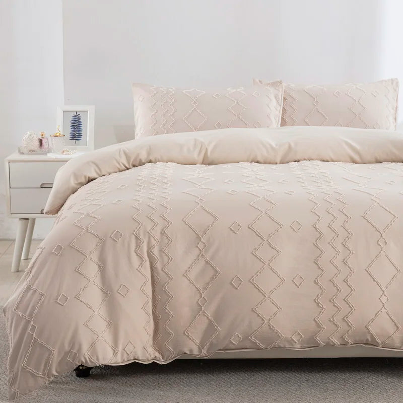 A beige boho tufted microfiber duvet cover set with matching pillows on a bed.