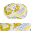 A ball of hand-knitted wool finger line scarf featuring yellow and gray stripes.
