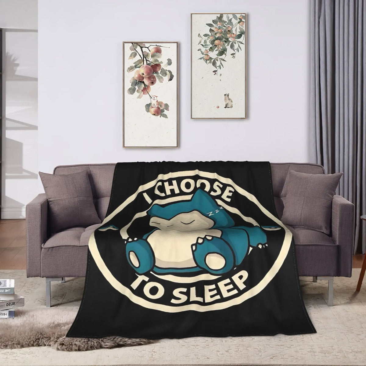 A black plush decorative throw blanket featuring a cartoon blue sleeping cat design.