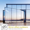 A modern glass facade featuring mirror effect outdoor film protecting privacy and security.