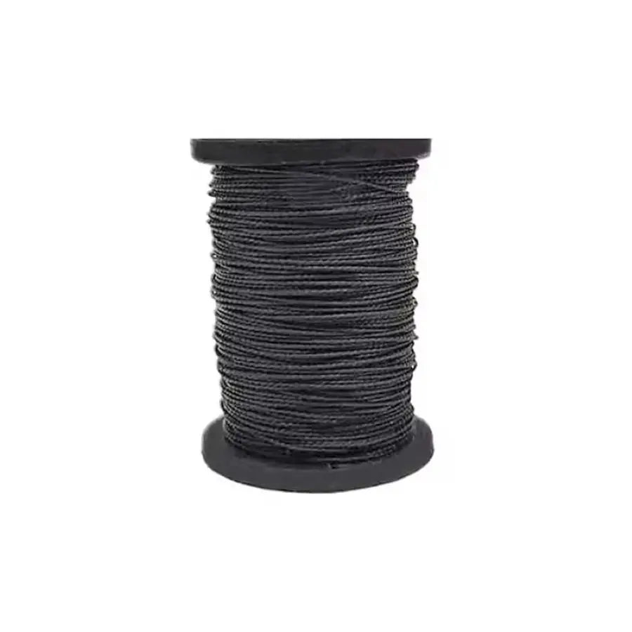 A spool of black waxed thread used for professional leather sewing kits.