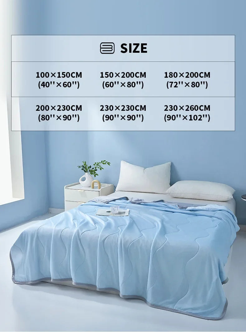 Light blue quilted bedspreads and pillows displayed next to a size chart.