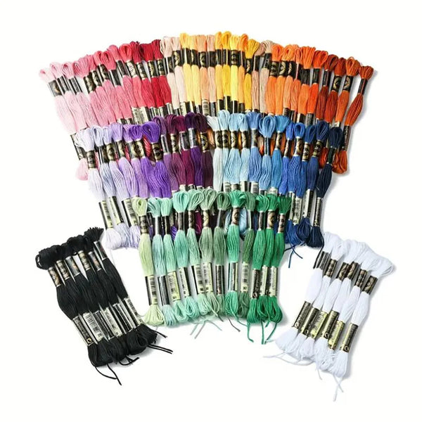 A collection of 12 packs of rainbow gradient embroidery floss threads in various colors and shades for crafting